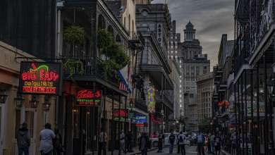 A view of a busy street in New Orleans at night.